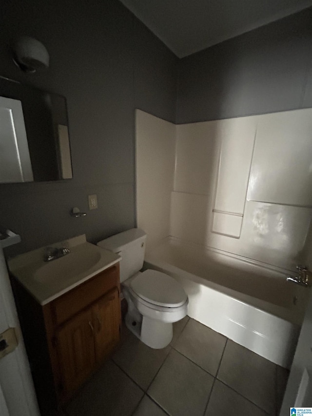 bathroom with vanity, tile patterned flooring, toilet, and  shower combination