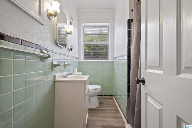 2857 Alexandria Wellington Rd, Alexandria, AL 36250 - bathroom featuring crown molding, vanity, wood finished floors, toilet, and tile walls