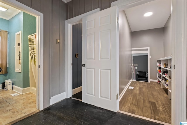 2857 Alexandria Wellington Rd, Alexandria, AL 36250 - corridor featuring crown molding, baseboards, visible vents, and dark wood-type flooring