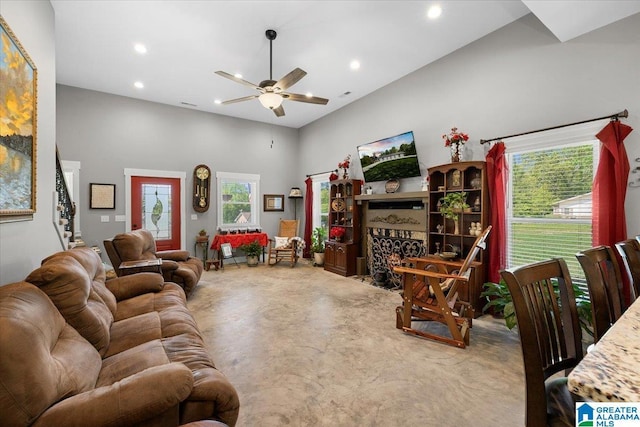 carpeted living room featuring a ceiling fan, recessed lighting, and plenty of natural light