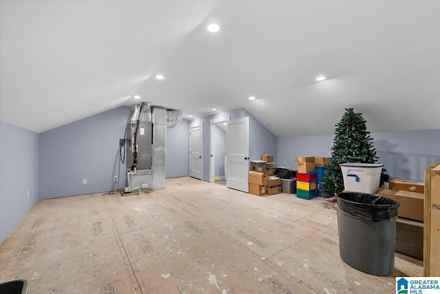 bonus room featuring heating unit and lofted ceiling