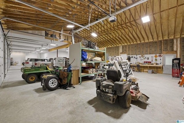 garage featuring a workshop area and a garage door opener