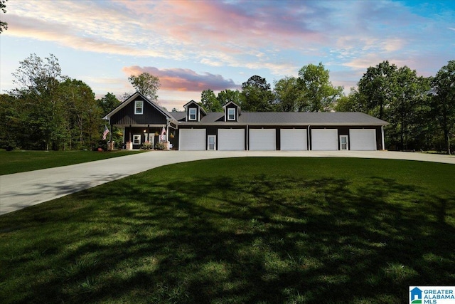 view of front of property with a yard and driveway
