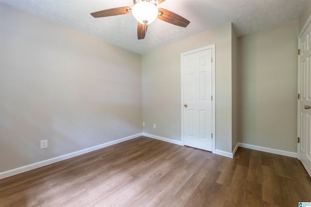 unfurnished bedroom with baseboards, ceiling fan, and wood finished floors