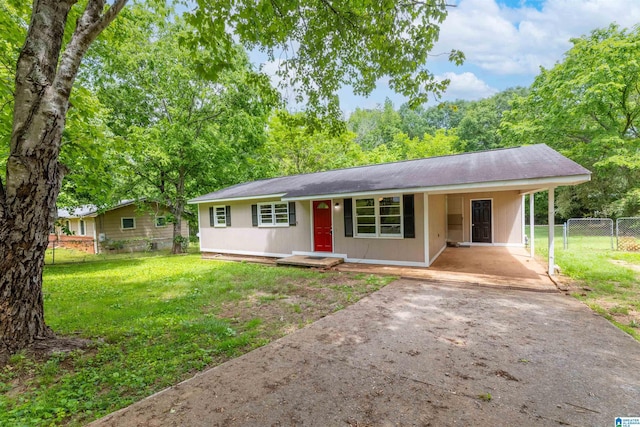 single story home with driveway, a front yard, a gate, fence, and an attached carport