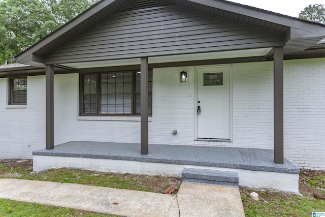 733 Heflin Ave E, Birmingham, AL 35214 - view of exterior entry with covered porch and brick siding