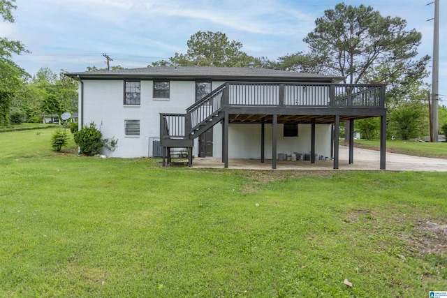 733 Heflin Ave E, Birmingham, AL 35214 - back of house with a lawn, a wooden deck, a patio area, stairway, and brick siding