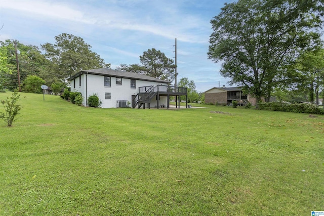 733 Heflin Ave E, Birmingham, AL 35214 - view of yard with stairway, a deck, and central AC