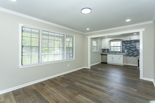 733 Heflin Ave E, Birmingham, AL 35214 - unfurnished living room featuring baseboards, ornamental molding, dark wood-type flooring, and recessed lighting