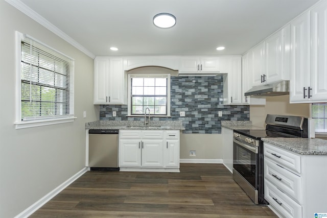 733 Heflin Ave E, Birmingham, AL 35214 - kitchen with light stone countertops, under cabinet range hood, a sink, backsplash, and stainless steel appliances
