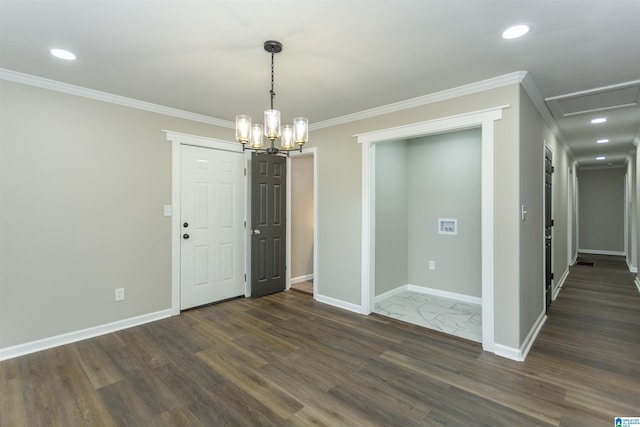 733 Heflin Ave E, Birmingham, AL 35214 - unfurnished room featuring crown molding, baseboards, dark wood finished floors, and an inviting chandelier