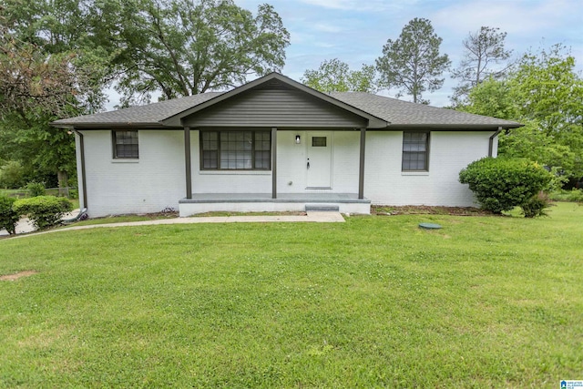 733 Heflin Ave E, Birmingham, AL 35214 - ranch-style house featuring brick siding, a shingled roof, a front lawn, and covered porch
