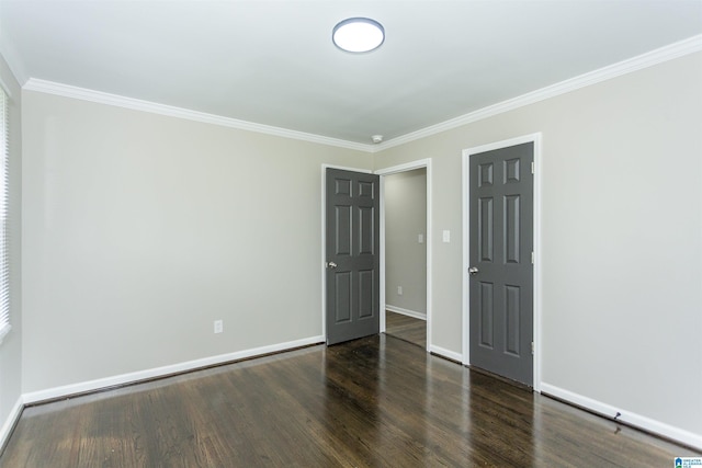733 Heflin Ave E, Birmingham, AL 35214 - unfurnished bedroom featuring crown molding, baseboards, and wood finished floors