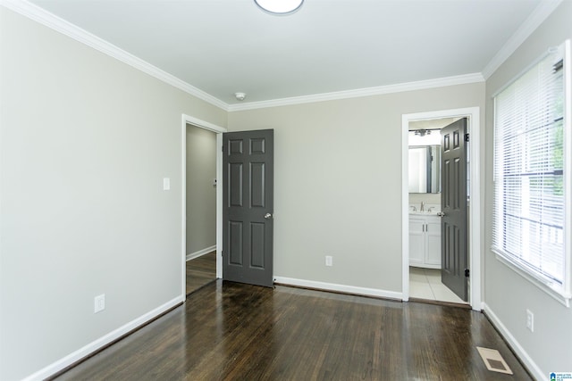 733 Heflin Ave E, Birmingham, AL 35214 - unfurnished bedroom with visible vents, ornamental molding, baseboards, and wood finished floors