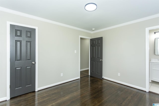 733 Heflin Ave E, Birmingham, AL 35214 - unfurnished bedroom featuring crown molding, baseboards, and wood finished floors