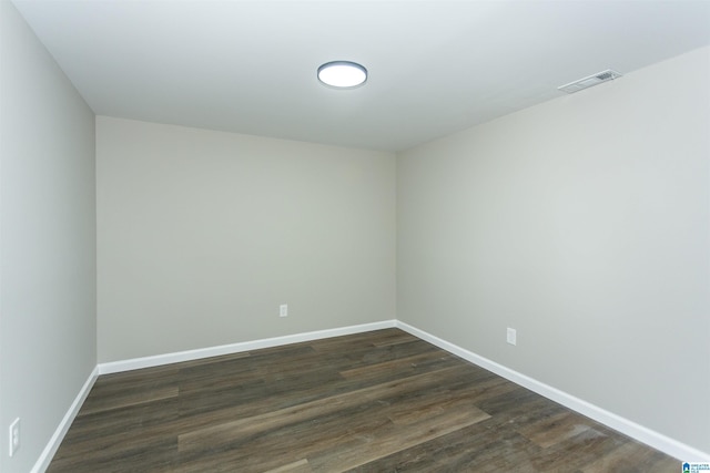 733 Heflin Ave E, Birmingham, AL 35214 - empty room featuring baseboards, dark wood-style flooring, and visible vents
