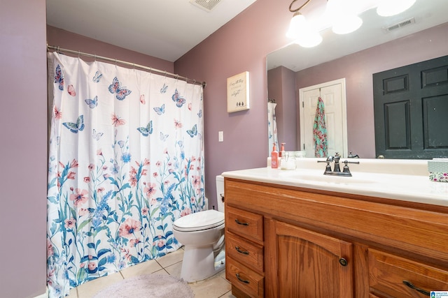 full bath featuring vanity, tile patterned flooring, toilet, and visible vents