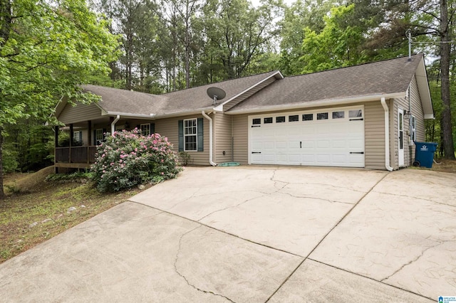 ranch-style house featuring concrete driveway, a shingled roof, a porch, and a garage