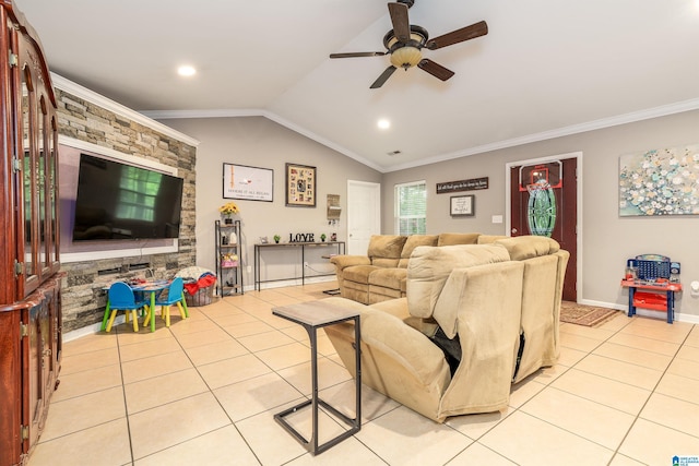 living area featuring light tile patterned floors, ornamental molding, vaulted ceiling, and ceiling fan