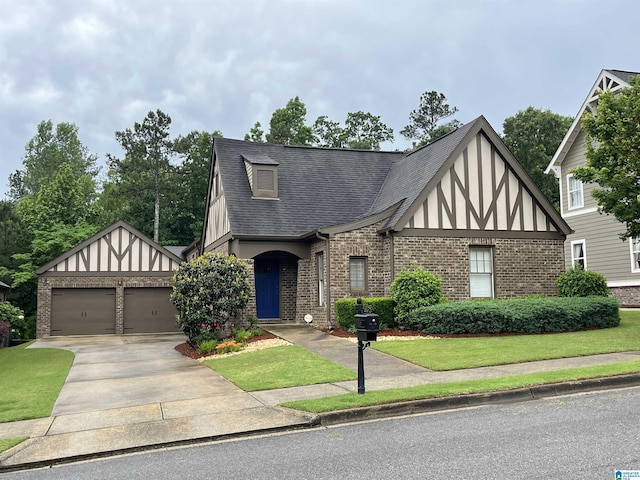 1516 James Hill Way, Hoover, AL 35226 - tudor-style house featuring brick siding, a shingled roof, and a garage