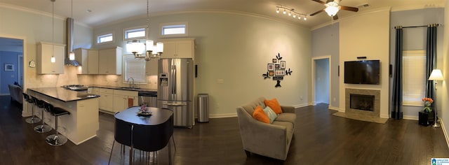 1516 James Hill Way, Hoover, AL 35226 - living room featuring dark wood-style flooring, visible vents, baseboards, ceiling fan with notable chandelier, and ornamental molding
