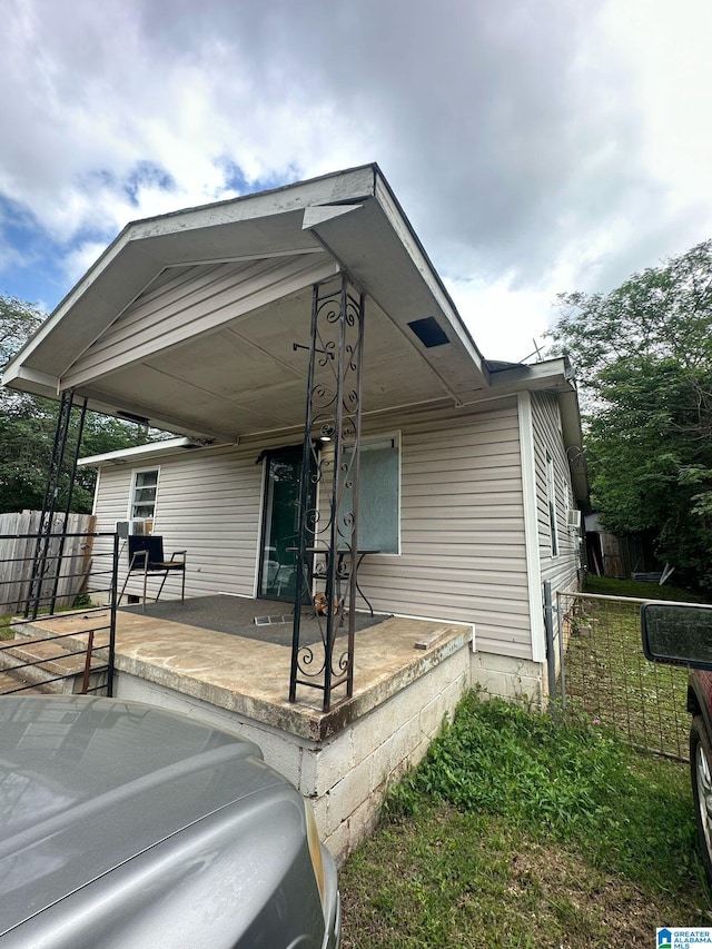 view of front of house featuring fence