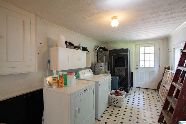 402 8th St, Clanton, AL 35045 - laundry room featuring cabinet space, separate washer and dryer, light flooring, ornamental molding, and a textured ceiling