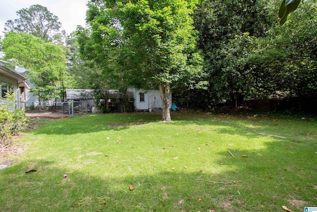 402 8th St, Clanton, AL 35045 - view of yard with an outdoor structure and a shed