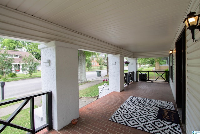 402 8th St, Clanton, AL 35045 - wooden deck with a porch