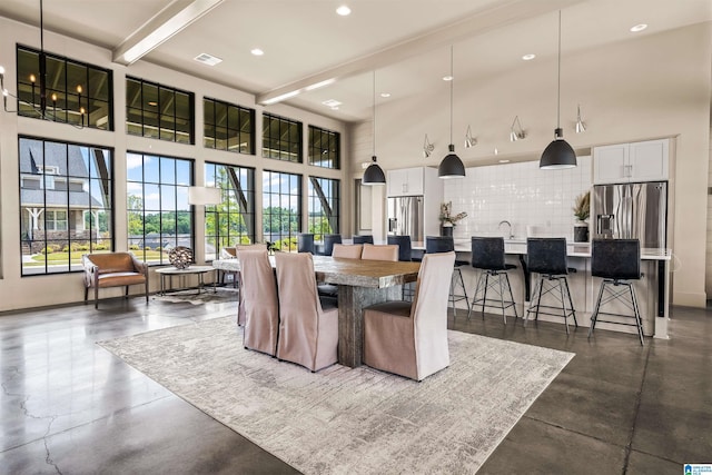 3304 Trip Run, Hoover, AL 35244 - dining area with finished concrete flooring, a towering ceiling, recessed lighting, and beamed ceiling