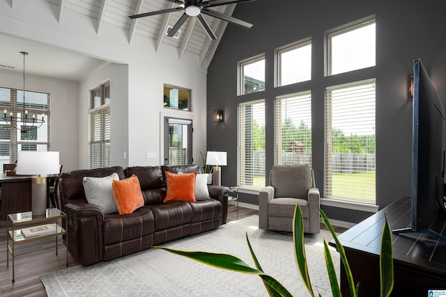 3304 Trip Run, Hoover, AL 35244 - living room with a chandelier, ceiling fan, wood finished floors, beamed ceiling, and baseboards