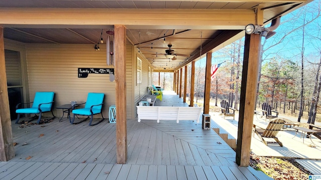 wooden deck featuring a ceiling fan
