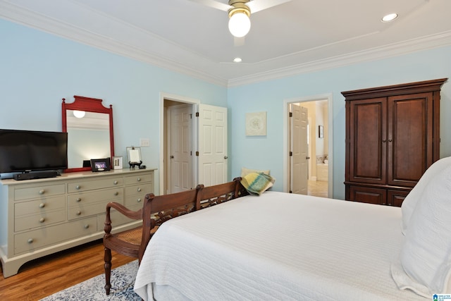 bedroom featuring crown molding, ceiling fan, ensuite bath, recessed lighting, and wood finished floors