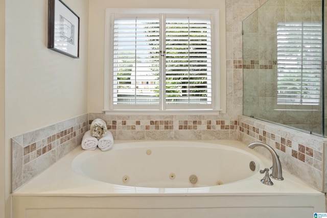 full bath featuring a whirlpool tub