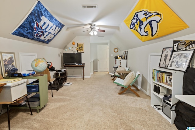 interior space with carpet floors, visible vents, baseboards, a ceiling fan, and vaulted ceiling