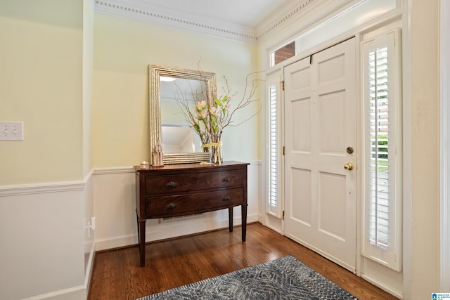 entryway with baseboards and wood finished floors