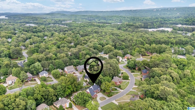 bird's eye view featuring a wooded view