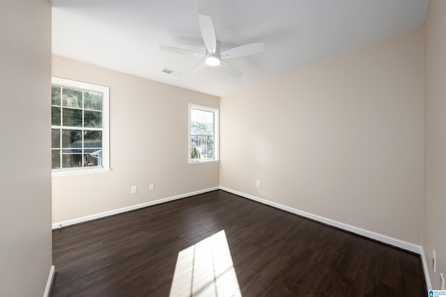 5708 Hickory Ct, Pinson, AL 35126 - empty room featuring dark wood-type flooring, a ceiling fan, and baseboards