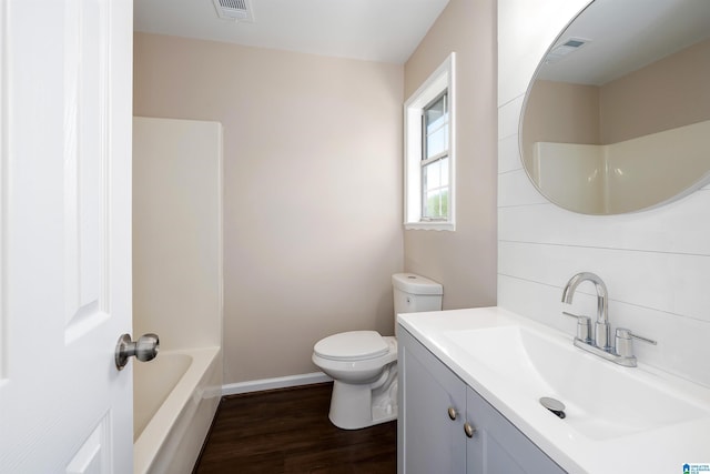 5708 Hickory Ct, Pinson, AL 35126 - full bath featuring toilet, wood finished floors, vanity, and baseboards