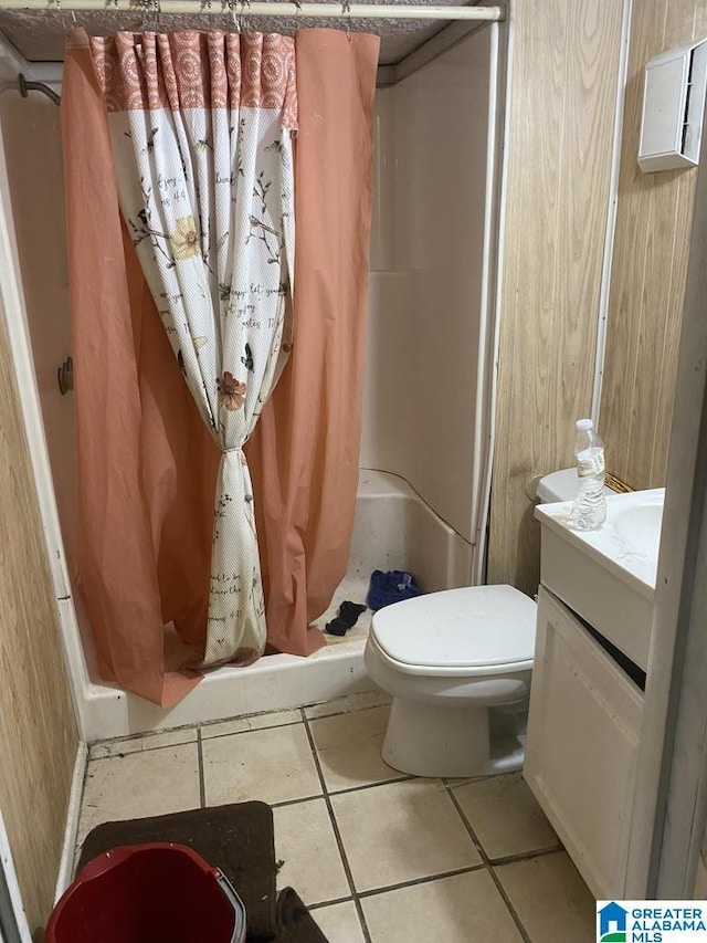 full bath with toilet, tile patterned floors, a shower stall, and vanity