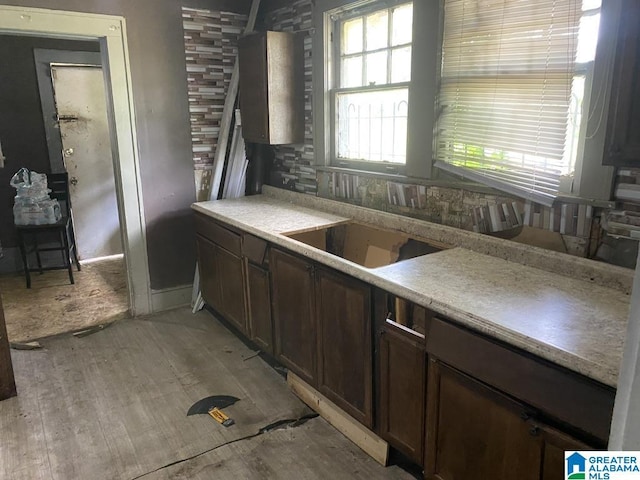 kitchen featuring light countertops and light wood-type flooring