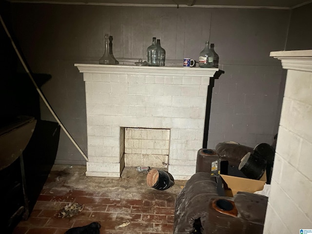 details with concrete block wall and a fireplace