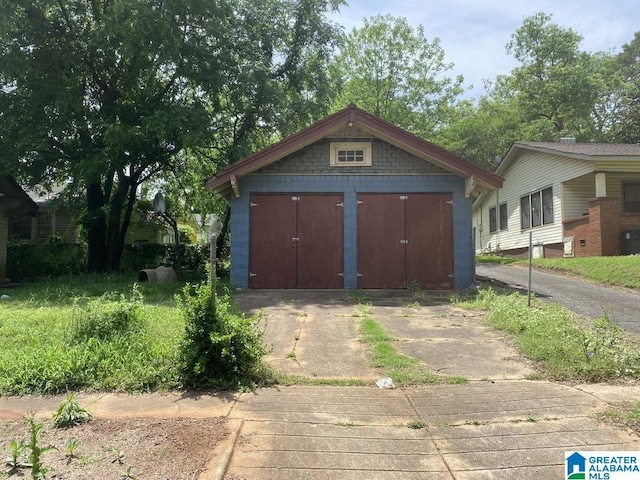 view of shed featuring driveway