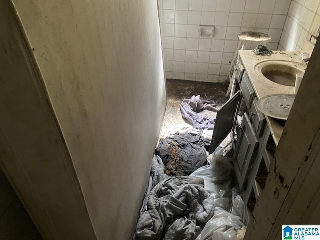 bathroom featuring double vanity and a sink