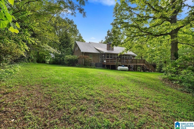 view of yard featuring stairway and a deck