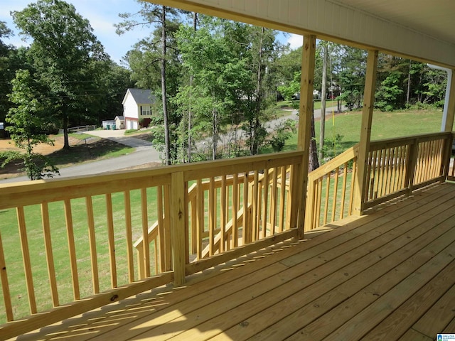 wooden deck with a yard