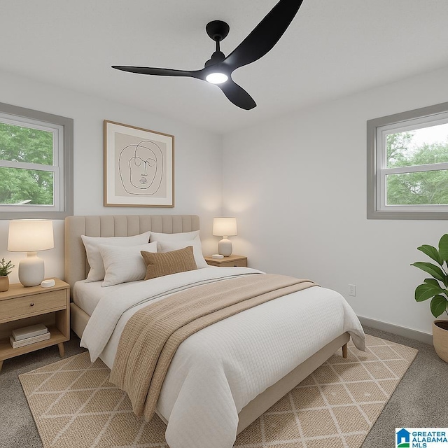 carpeted bedroom with baseboards and ceiling fan