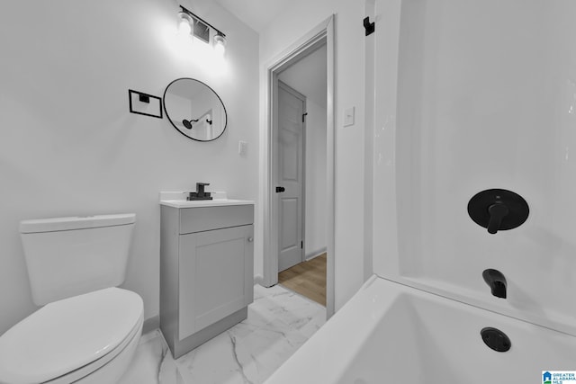 full bathroom with vanity, baseboards, toilet, and marble finish floor