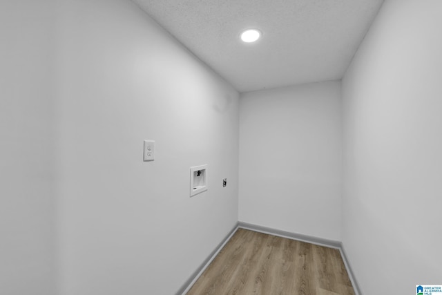 washroom with laundry area, baseboards, washer hookup, light wood finished floors, and hookup for an electric dryer
