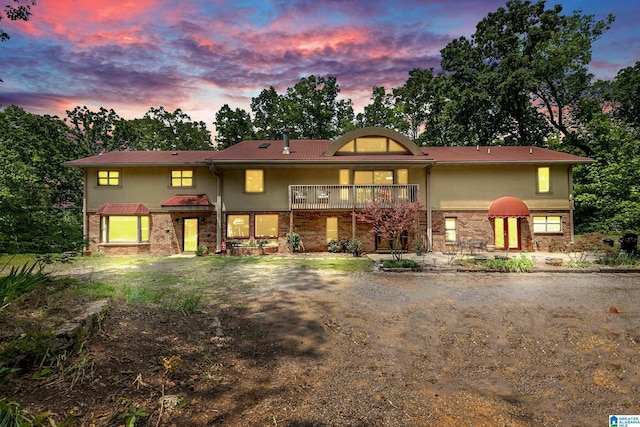 323 Taylor Rd, Remlap, AL 35133 - view of front facade with a balcony, a patio, and brick siding